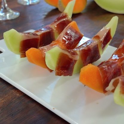 Jamón Ibérico de Bellota with fresh melon. Traditional Spanish refreshing dish