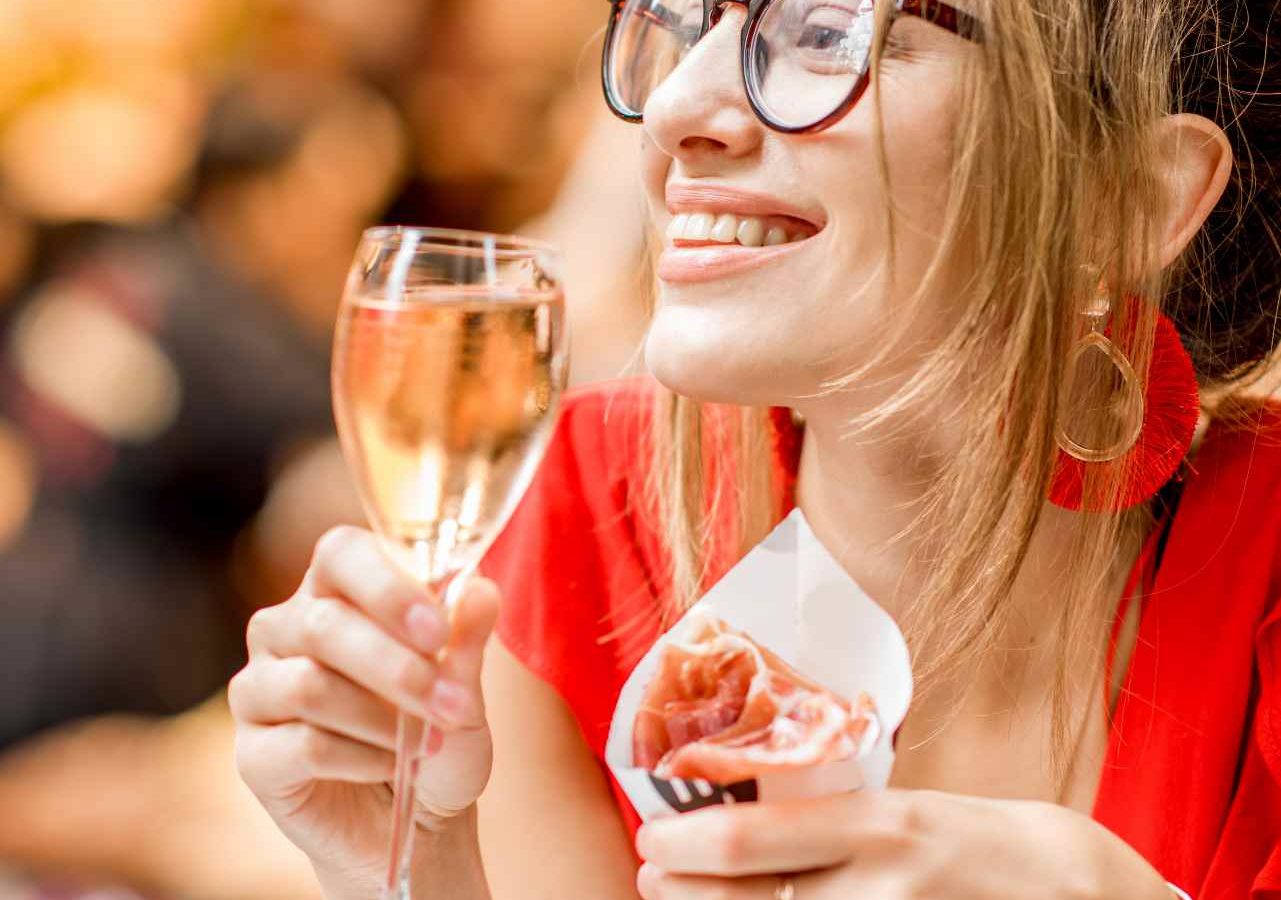 Woman enjoying Spanish Tapas in Barcelona