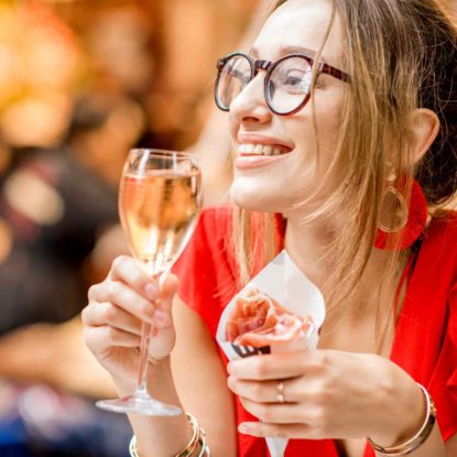 Woman enjoying Spanish Tapas in Barcelona