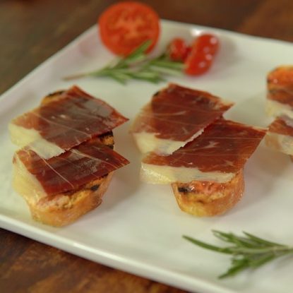 Spanish toast of Jamón Ibérico de Bellota and rubbed tomato. Pan tumaca